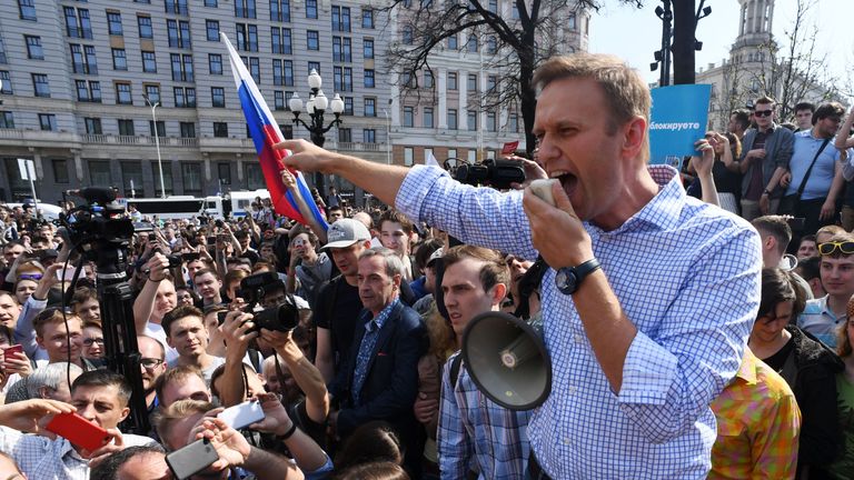 Russian opposition leader Alexei Navalny addresses supporters during an unauthorised anti-Putin rally 