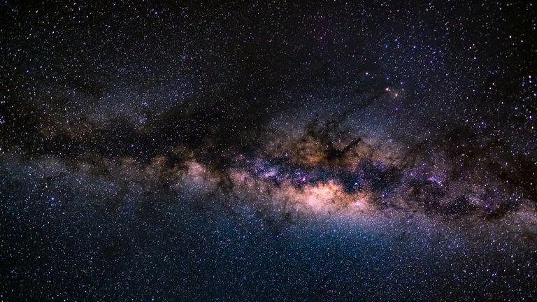 Galactic Collision Could Wake Up Milky Ways Dormant Black