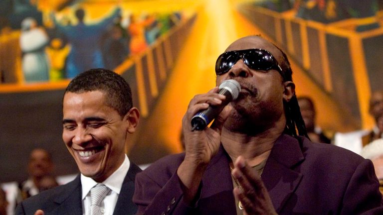 LOS ANGELES - APRIL 29: Democratic presidential hopeful Senator Barack Obama (D-IL) (L) is joined by a singing Stevie Wonder during a service commemorating the Los Angeles riots at the First AME Church April 29, 2007 in Los Angeles, California. The Los Angeles riots, which started 15 years ago on April 29, 1992, lasted three days and resulted in 53 deaths.  (Photo by Ann Johansson/Getty Images) *** Local Caption *** Barack Obama;Stevie Wonder