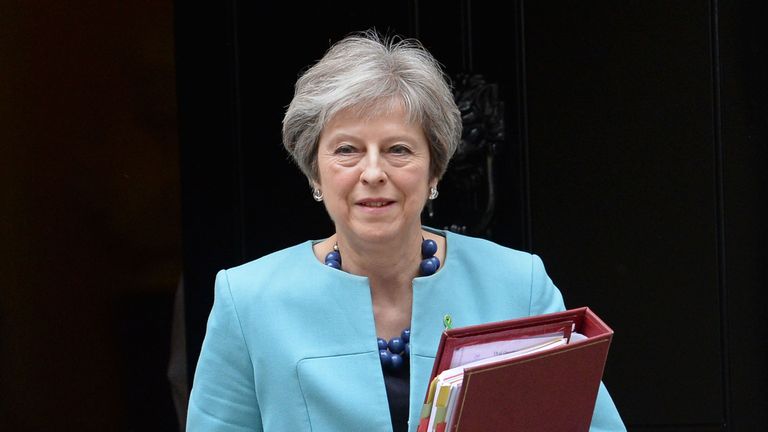 Theresa May leaves Downing Street for the Commons to face Prime Minister&#39;s Questions