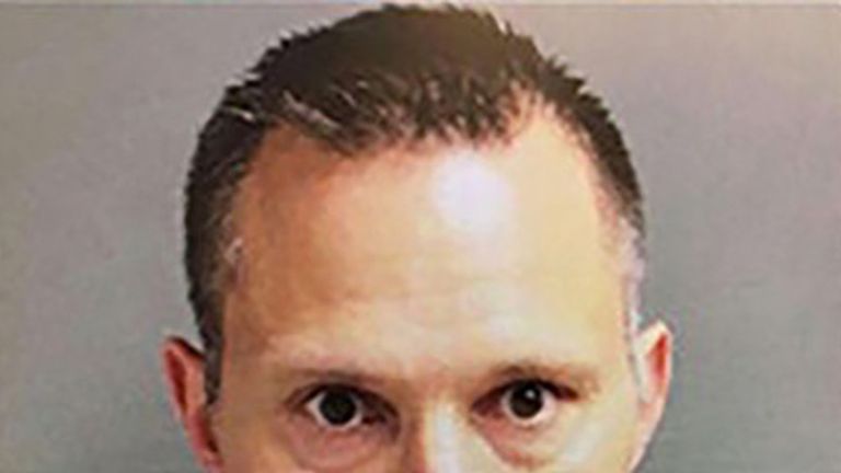 Thomas Tramaglini, 42, has been arrested by police hunting a "mystery pooper" who relieved himself on school grounds "on a daily basis" in New Jersey. Pic: Holmdel Police Dept
