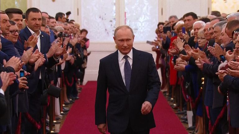 Vladimir Putin is applauded as he attends his inauguration