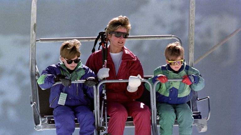 The Princess of Wales rides a chair lift up the Kriegerhorn with her sons Prince William, left, and Prince Harry in 1991