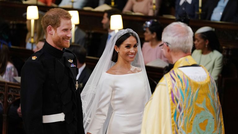 Prince Harry and Meghan Markle smile during the ceremony