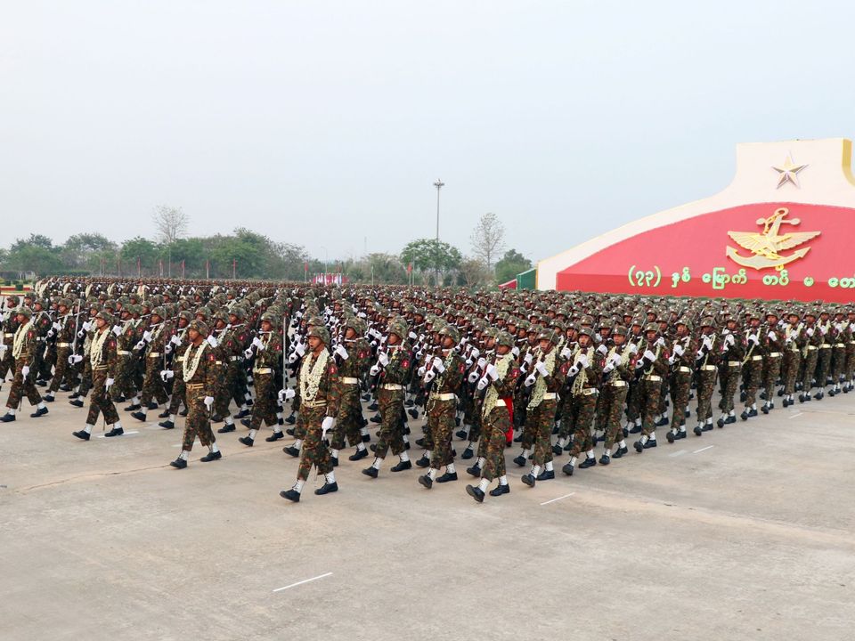 Myanmar soldiers march in formation during a military parade in Naypyidaw on March 27, 2018 to mark the 73rd Armed Forces Day. / AFP PHOTO / Thet AUNG (Photo credit should read THET AUNG/AFP/Getty Images)