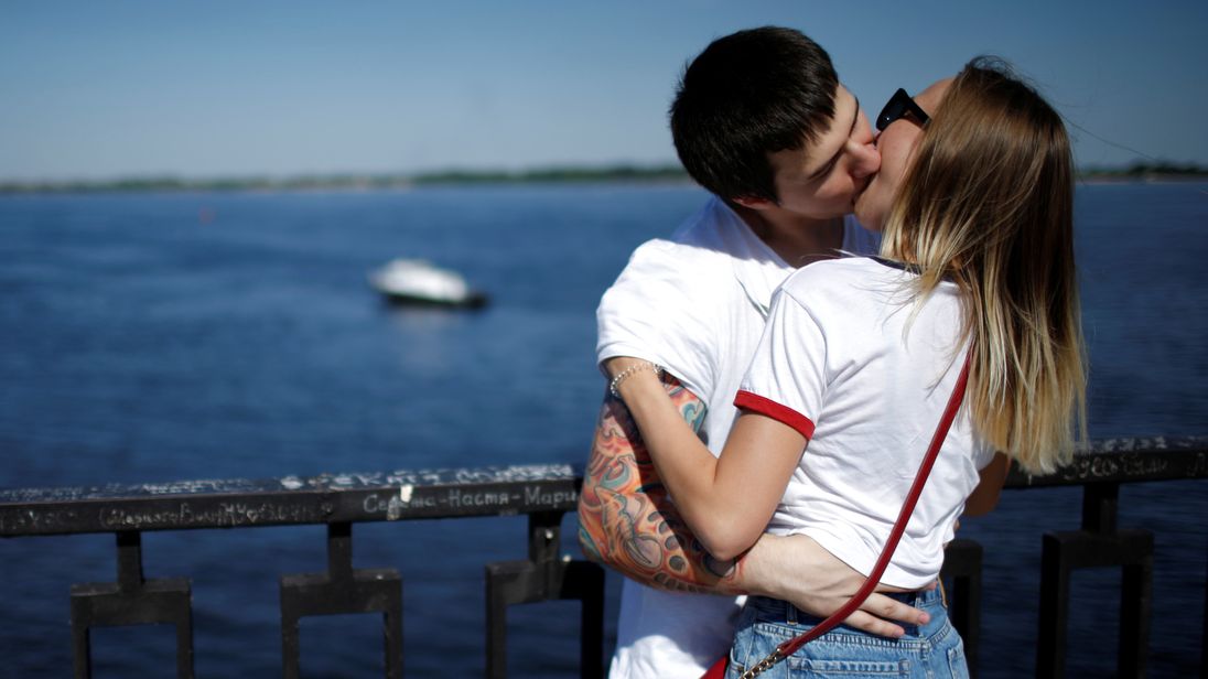 A couple kisses on the banks of the Volga river in Volgograd Russia