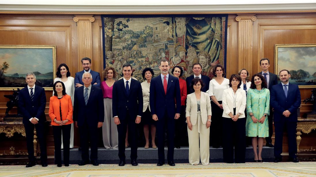 Spain's new cabinet members stand with King Felipe during a swearing-in ceremony at the Zarzuela Palace outside Madrid