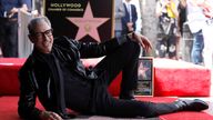 Jeff Goldblum strikes a pose as he unveils his star