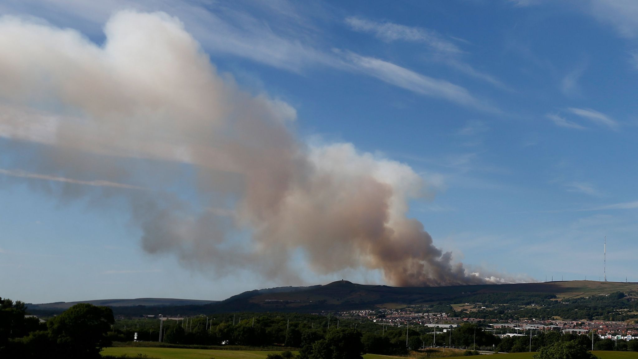 'Rapidly developing' Winter Hill wildfire continues to rage near Bolton