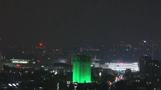 Grenfell Tower lit up green on the first anniversary of the fire