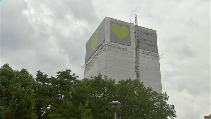 The tower has been covered in white a year after the fire