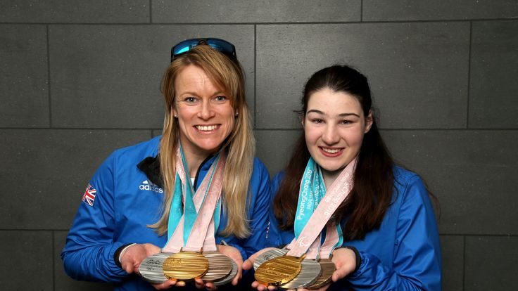 Menna Fitzpatrick (R) and her guide Jen Kehoe pose with their medals after the 2018 Paralympic Winter Games