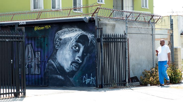A wall dedicated to the memory of US rapper Tupac Shakur is seen on May 26, 2016 in Los Angeles, California. Twenty years after his death, Tupac still reigns. Other rappers have succeeded him in stardom, and promotional efforts around Tupac have been haphazard, but the artist who died at age 25 on September 13, 1996, in Las Vegas, maintains a hold that is among the most enduring in recent times. / AFP / VALERIE MACON / TO GO WITH AFP STORY by Shaun TANDON, '20 years on, Tupac reigns as potent gl