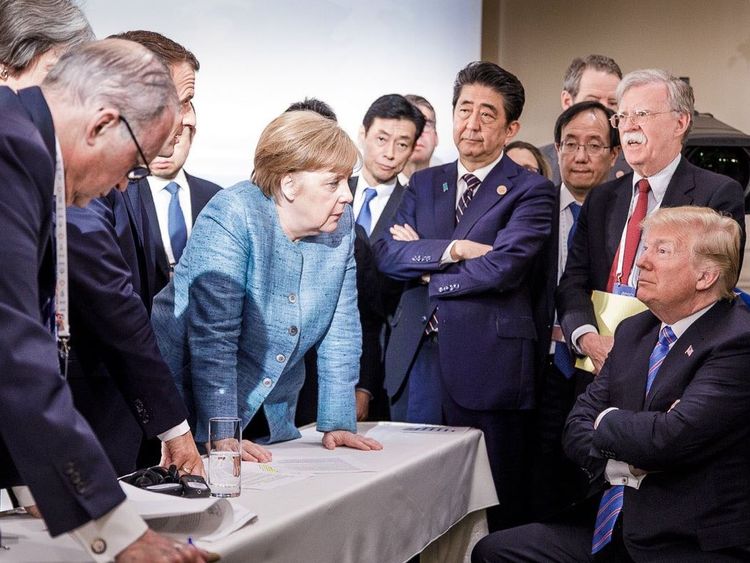 A photo shared on Angela Merkel's official Instagram account hints at tension among G7 leaders