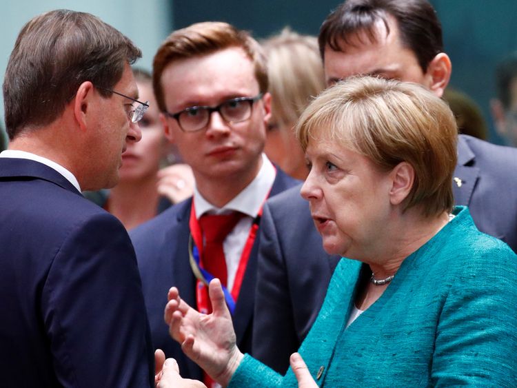 German Chancellor Angela Merkel talks with Slovenian Prime Minister Miro Cerar at EU summit