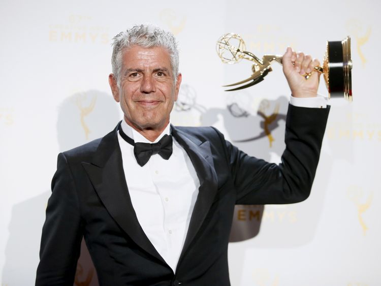 Bourdain with an Emmy Award for Parts Unknown in 2015