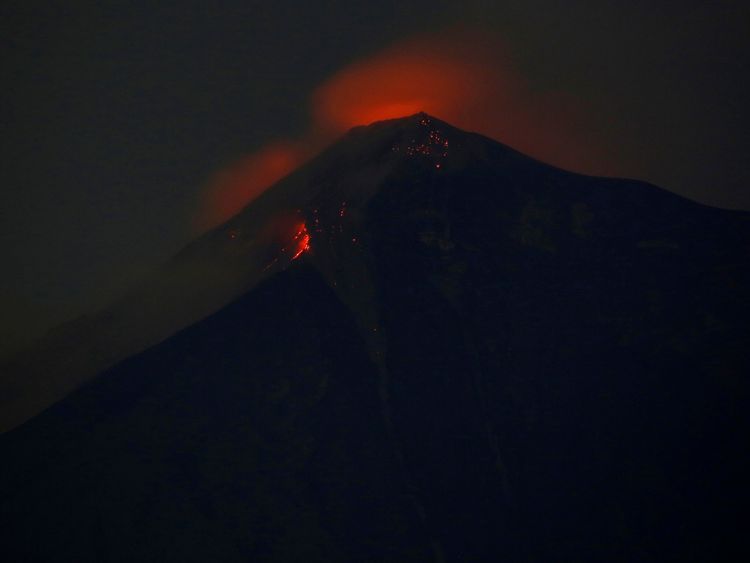 Fuego volcano glows red after erupting violently
