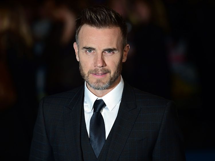 Gary Barlow has apologised to environmental campaigners for firing plastic confetti over the crowd