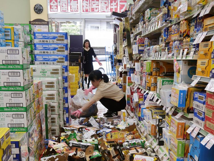 Shop items litter the floor of a convenience store, following the earthquake in Hirakata, Osaka