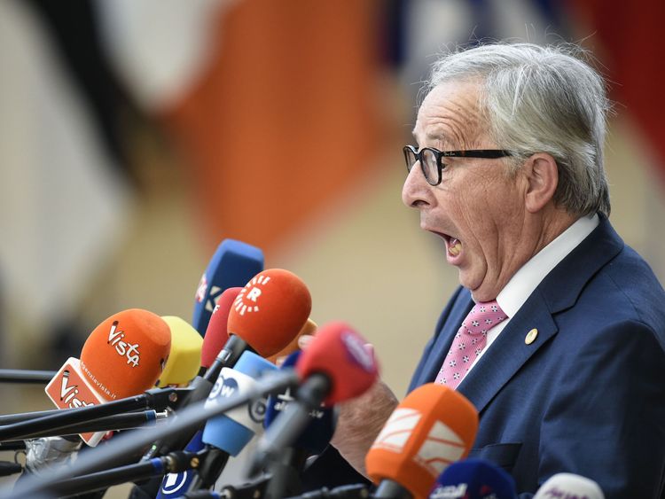 TOPSHOT - President of the European Commission Jean-Claude Juncker reacts as he speaks to journalists during an European Union leaders' summit focused on migration, Brexit and eurozone reforms on June 28, 2018 at the Europa building in Brussels. - The two-day meeting in Brussels is expected to be dominated by deep divisions over migration, with German Chancellor saying the issue could decide the fate of the bloc itself. (Photo by JOHN THYS / AFP) 