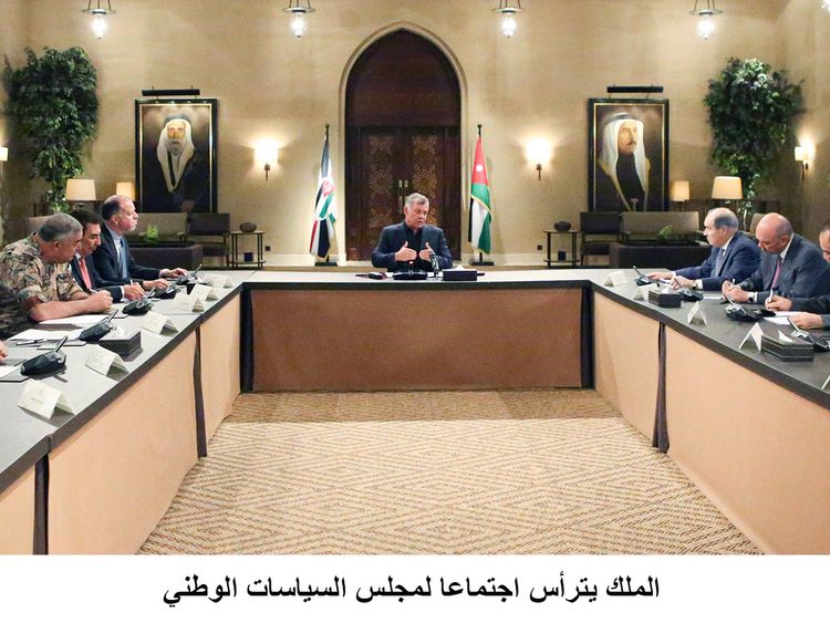 King Abdullah presides over a meeting of top government officials amid a crisis over tax laws