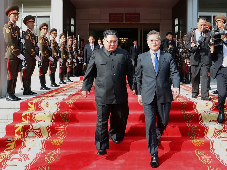 In this handout image provided by South Korean Presidential Blue House, South Korean President Moon Jae-in (R) walks with North Korean leader Kim Jong-un (L) during their meeting on May 26, 2018 in Panmunjom, North Korea