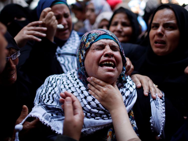 A relative mourns during the Razan&#39;s funeral