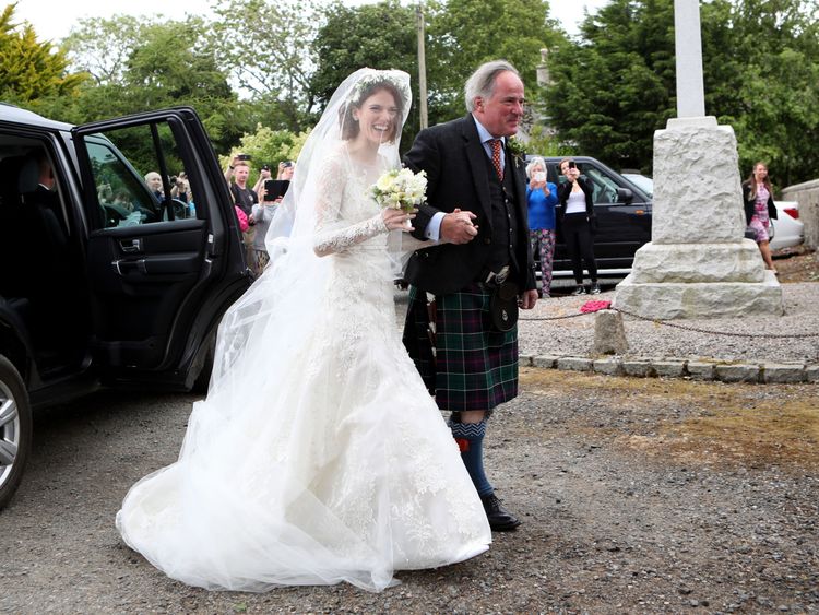 Rose Leslie with her father, arriving at church in Aberdeenshire
