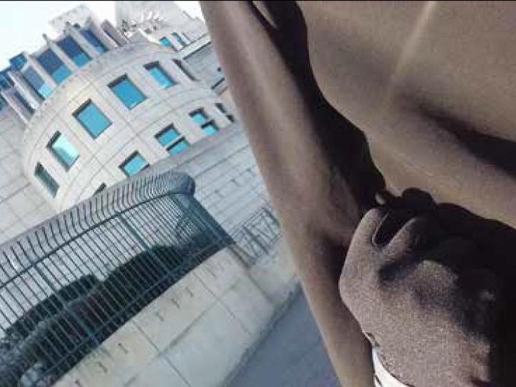 Safaa Boular took a selfie with a clenched fist at the MI6 building