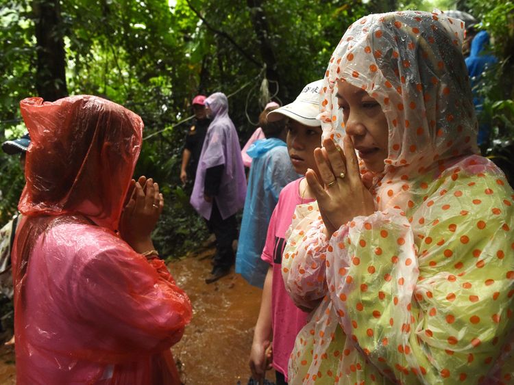 Families have kept vigil at the cave entrance