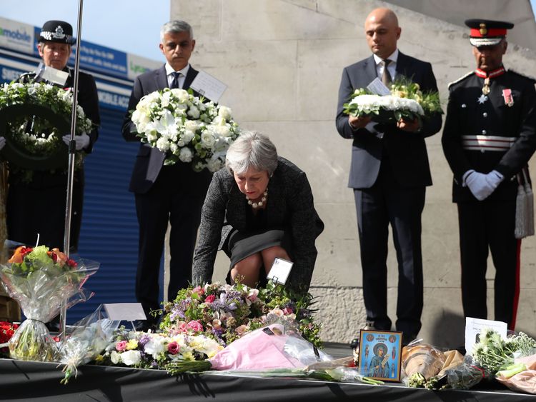 Theresa May lays a floral tribute at the Southwark Needle