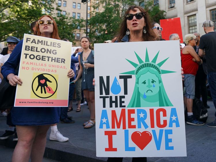 People attend a rally protesting the separation of children from their families while crossing the US border illegally on June 14, 2018 in New York