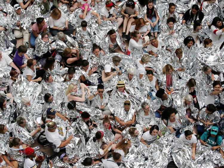 Immigration activists wrapped in silver blankets, symbolising immigrant children that were seen in similar blankets at a U.S.-Mexico border detention facility in Texas, protest inside the Hart Senate Office Building after marching to Capitol Hill in Washington, U.S., June 28, 2018. REUTERS/Jonathan Ernst