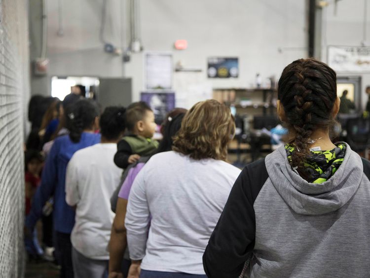 Women stand in line at the McAllen facility in Texas
