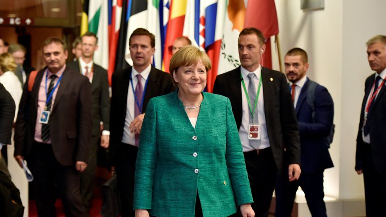 German Chancellor Angela Merkel leaves a European Union leaders summit in Brussels