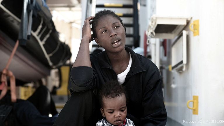 Migrants from Aquarius rescue convoy arrive in port of Valencia | World ...