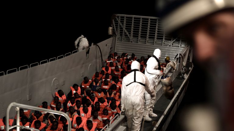 Migrants are rescued by staff members of the MV Aquarius on 10 June