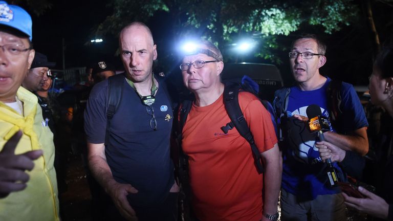 Richard William Stanton (2nd-L), Robert Charles Harper (3rd-L) and John Volanthen (R) arrive at the caves