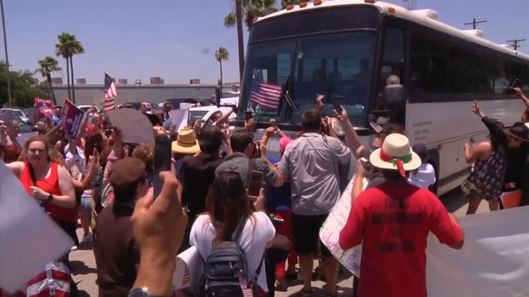 Protesters block bus
