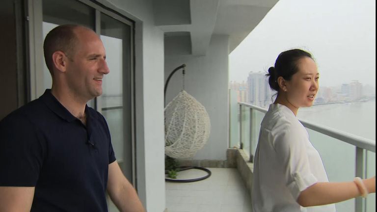 Zhang Tong, an estate agent working at Moon Island, with Tom Cheshire
