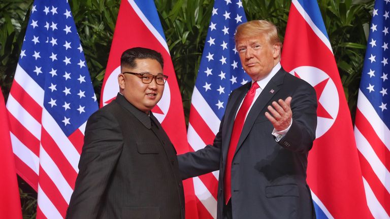 SINGAPORE - JUNE 12: In this handout photo, North Korean leader Kim Jong-un (L) meets U.S. President Donald Trump during their historic U.S.-DPRK summit at the Capella Hotel on Sentosa island on June 12, 2018 in Singapore. U.S. President Trump and North Korean leader Kim Jong-un held the historic meeting between leaders of both countries on Tuesday morning in Singapore, carrying hopes to end decades of hostility and the threat of North Korea&#39;s nuclear program. (Photo by Kevin Lim/THE STRAITS TIM