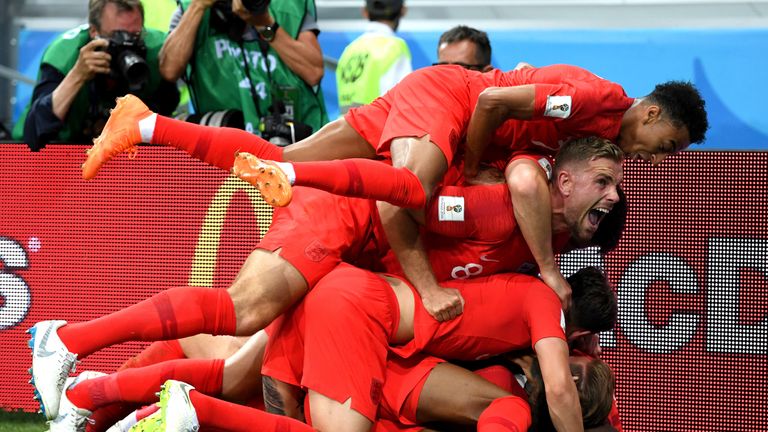 Harry Kane was mobbed by his teammates after his late winner