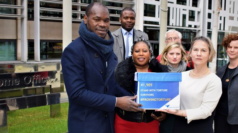 Mr Haoussou hands  a petition to former MP Tania Matthias at the home office
