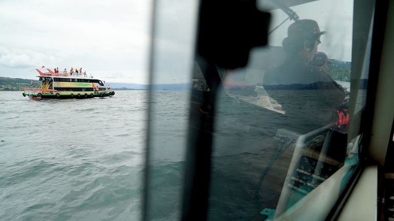 Rescue teams search for victims at the Lake Toba ferry port in the province of North Sumatra 