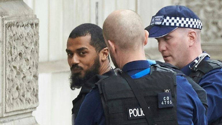 Firearms officiers from the British police detain a man, later named as Khalid Mohammed Omar Ali, on Whitehall near the Houses of Parliament in central London on April 27, 2017 before being taken away by police. Metropolitan police attended an incident on Whitehall in central London near the Houses of Parliament where one man was arrested, police said. Khalid Mohammed Omar Ali, a 27-year-old from north London, is accused of preparing terrorist acts after being arrested not far from Prime Ministe
