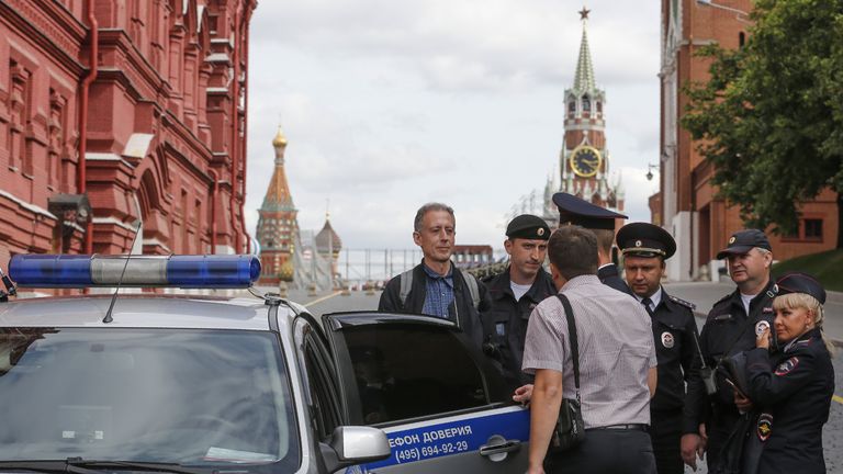 Russian police officers arrest British gay rights activist Peter Tatchell following his anti-Putin protest in Moscow on June 14, 2018. (Photo by Maxim ZMEYEV / AFP) (Photo credit should read MAXIM ZMEYEV/AFP/Getty Images)
