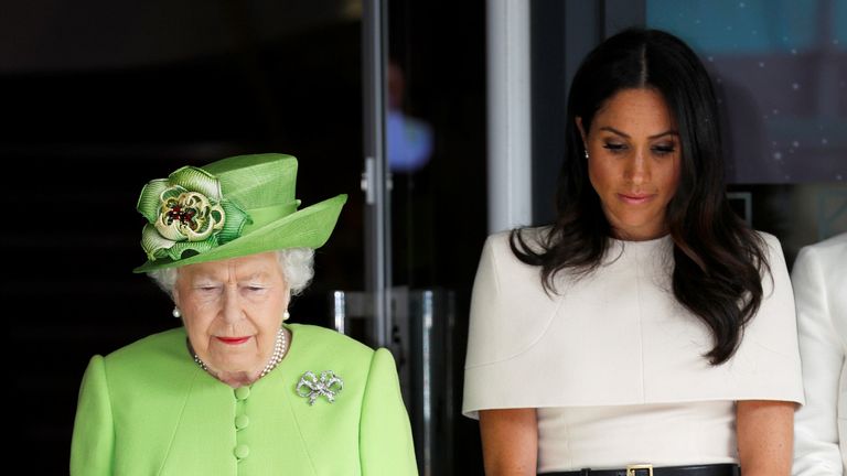The Queen and Meghan observe a minute&#39;s silence for Grenfell