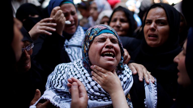 A relative mourns during the Razan&#39;s funeral