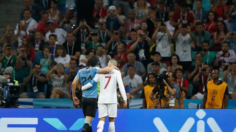 Ronaldo helps Edinson Cavani off the field after the match-winner picks up a know