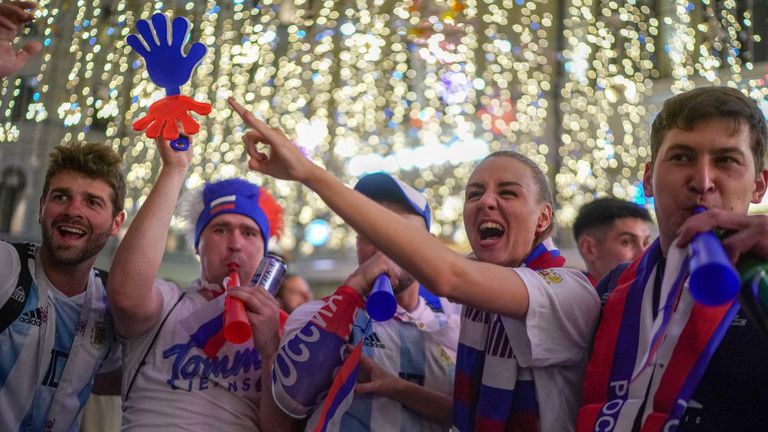 Russian football fans celebrate their national team&#39;s 3-1 win over Egypt in the streets near Red Square